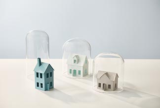 Houses placed under glass container.